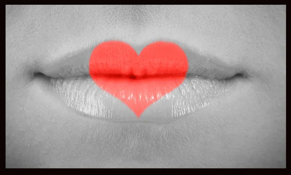 Woman lips with heart — Stock Photo, Image
