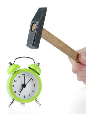 Hammer in hand and alarm clock isolated on white clipart