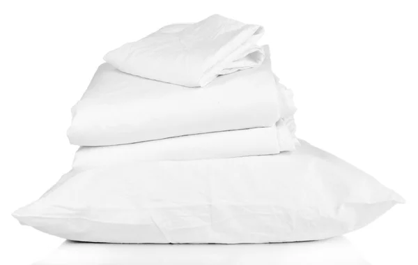 Stack of rumpled bedding sheets isolated on white — Stock Photo, Image