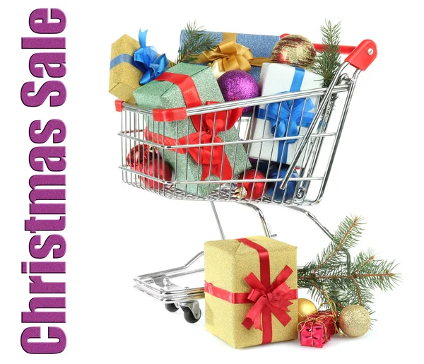 Christmas gifts in shopping trolley, isolated on white — Stock Photo, Image