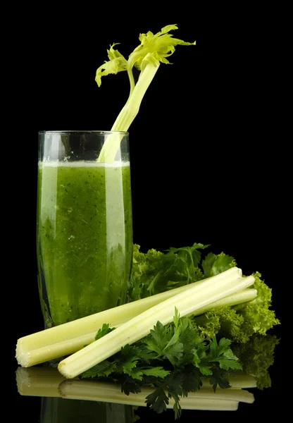 Glass of green vegetable juice and celery isolated on black — Stock Photo, Image