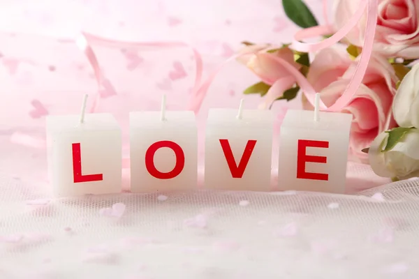 Candles with printed sign I LOVE YOU,on light background — Stock Photo, Image