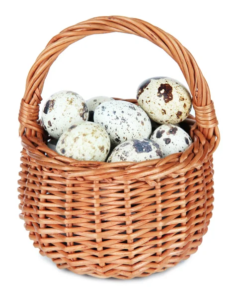 Quail eggs in wicker basket isolated on white — Stock Photo, Image