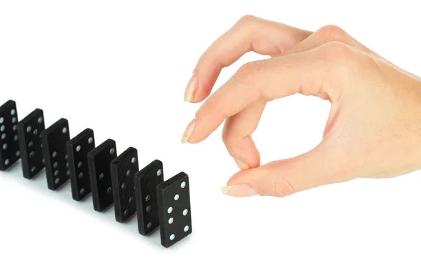 Mano spingendo domino isolato su bianco — Foto Stock