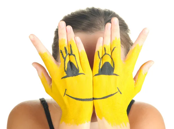 Portrait of girl hiding her face under smile mask isolated on white — Stock Photo, Image