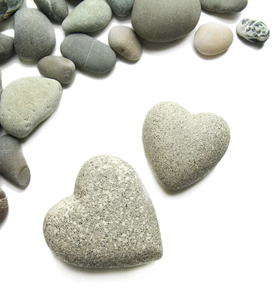 Сірі камені у формі серця, ізольовані на білому — стокове фото