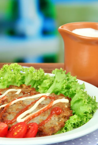Potato pancakes on plate, on bright background — Stock Photo, Image