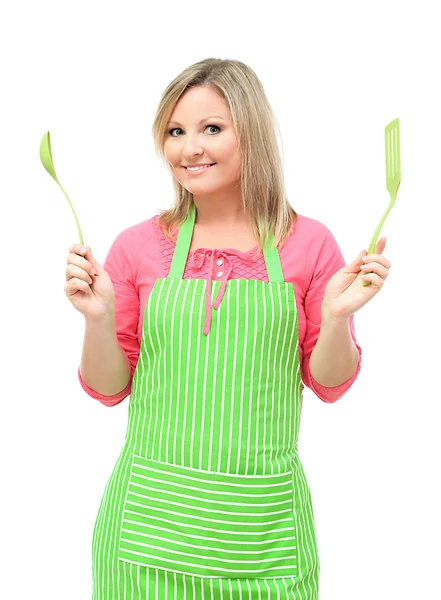 Woman with spoon and spatula, isolated on white — Stock Photo, Image