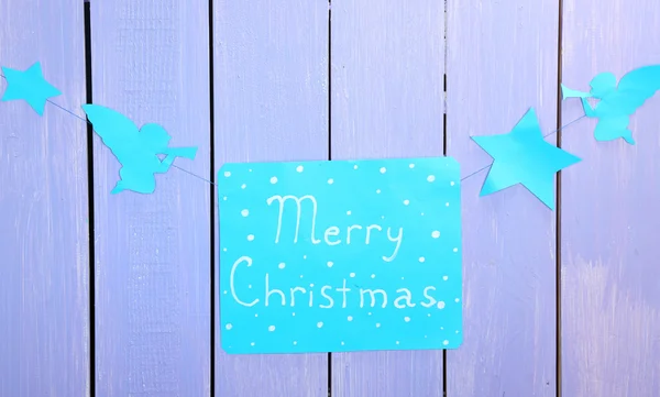 Panneau avec des mots Joyeux Noël sur fond de table en bois close-up — Photo