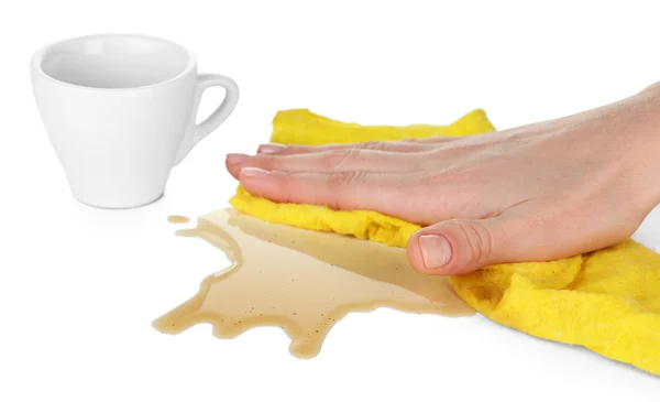 Hand wiping surface with yellow rag and cup of coffee isolated on white — Stock Photo, Image