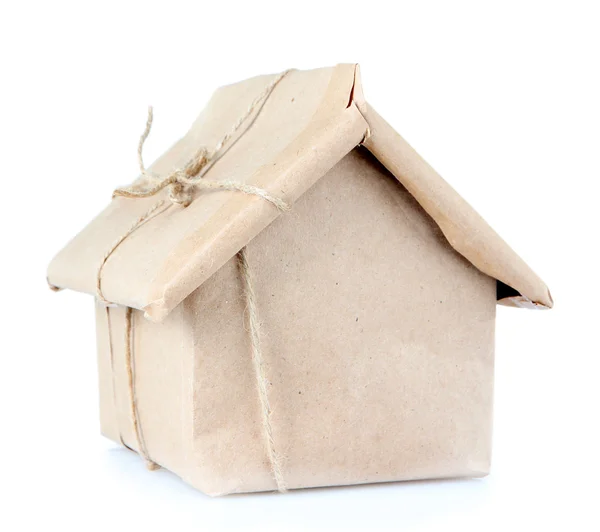 House wrapped in brown kraft paper, isolated on white — Stock Photo, Image