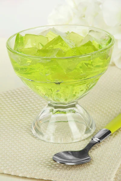 Tasty jelly cubes in bowl on table on light background — Stock Photo, Image