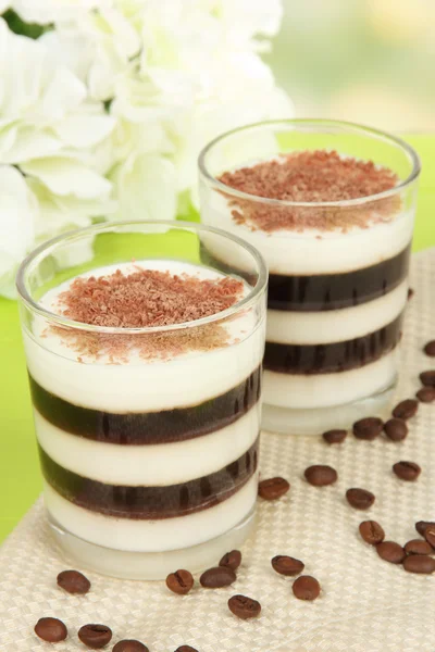 Tasty jelly coffee with milk on table on light background — Stock Photo, Image