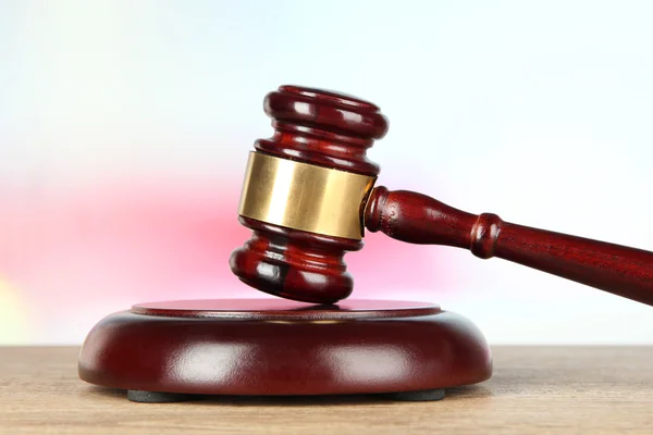 Judges gavel on wooden table on light background — Stock Photo, Image