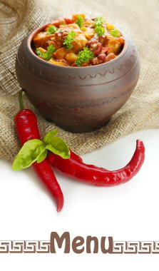 Chili Corn Carne - traditional mexican food, in pot, on sackcloth, isolated on white clipart