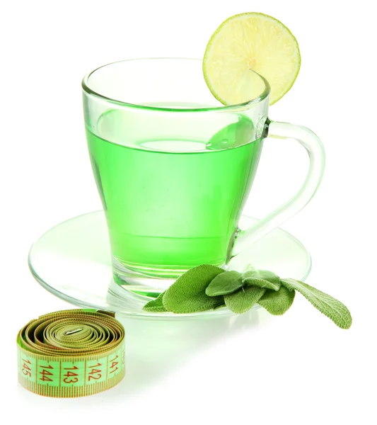 Taza transparente de té verde y cinta métrica aislada en blanco —  Fotos de Stock