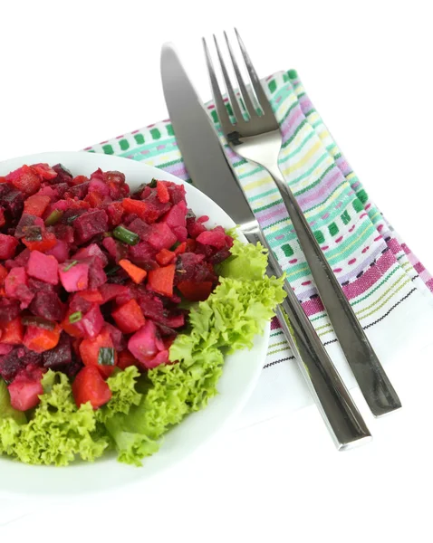 Beet salad on plate on napkin isolated on white — Stock Photo, Image