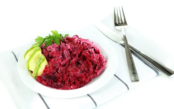 Beet salad on plate on napkin isolated on white — Stock Photo, Image