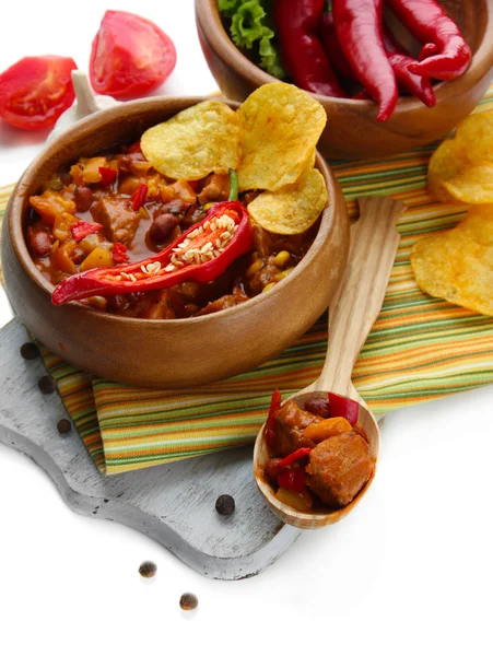 Chili Corn Carne - traditional mexican food, in wooden bowl, on napkin, isolated on white — Stock Photo, Image