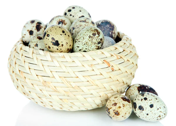 Quail eggs in wicker basket isolated on white — Stock Photo, Image