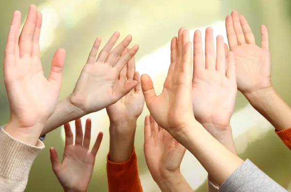 Human hands on bright background — Stock Photo, Image