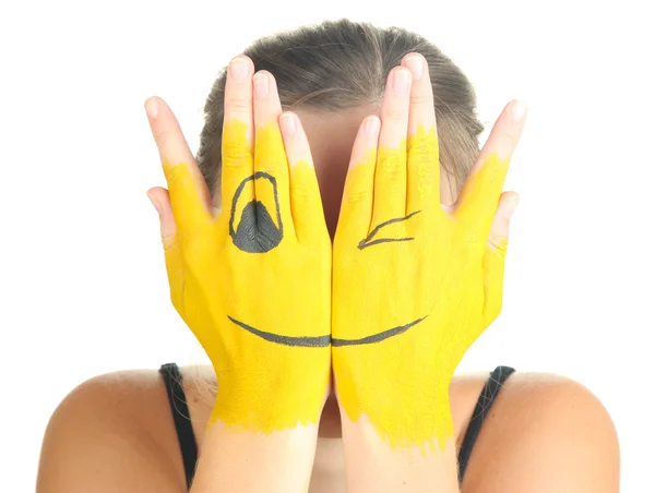 Portrait of girl hiding her face under smile mask isolated on white — Stock Photo, Image