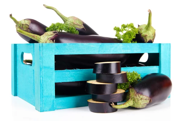 Fresh eggplants in wooden box isolated on white — Stock Photo, Image