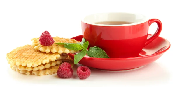 Cup of tea with cookies and raspberries isolated on white — Stock Photo, Image