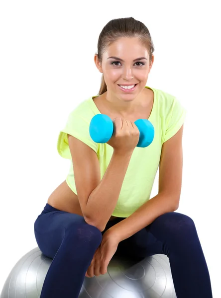 Beautiful young girl doing exercises at home — Stock Photo, Image