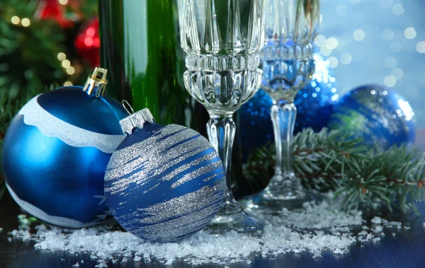 Composition with Christmas decorations and two champagne glasses, on bright background — Stock Photo, Image