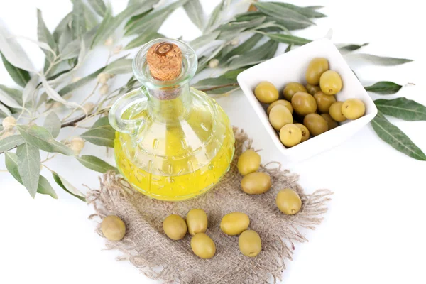 Olive oil with olives in bowl and branch on sackcloth isolated on white — Stock Photo, Image