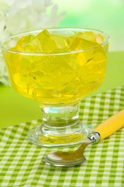 Tasty jelly cubes in bowl on table on light background — Stock Photo, Image