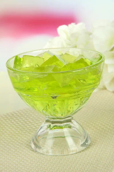 Tasty jelly cubes in bowl on table on light background — Stock Photo, Image