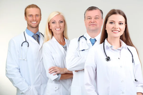 Medical workers on grey background Royalty Free Stock Images