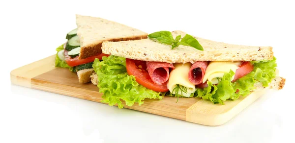 Tasty sandwiches with salami sausage and vegetables on cutting board, isolated on white — Stock Photo, Image