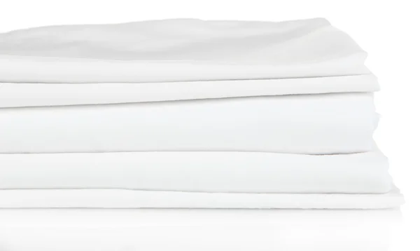 Montón de sábanas limpias aisladas en blanco — Foto de Stock