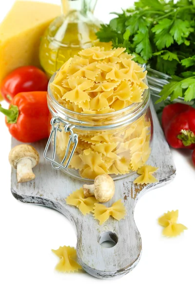 Pasta with oil, cheese and vegetables isolated on white — Stock Photo, Image