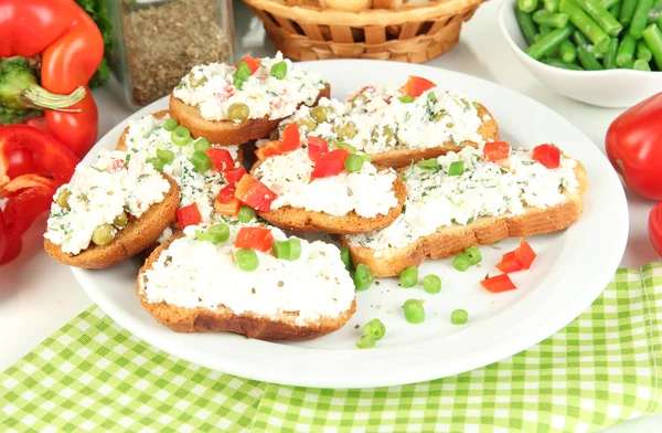 Sandwiches with cottage cheese and greens on plate isolated on white — Stock Photo, Image