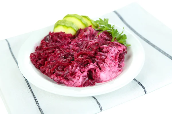 Beet salad on plate on napkin isolated on white — Stock Photo, Image