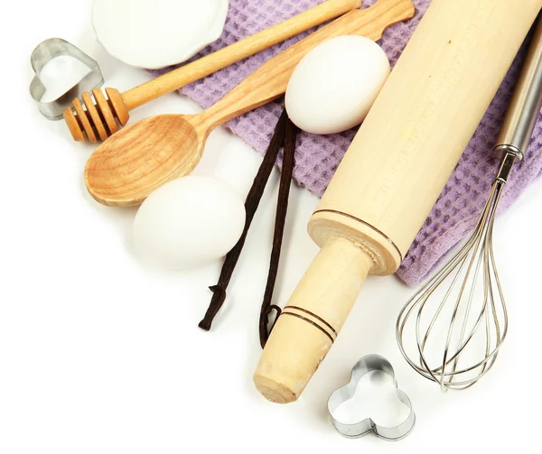 Cooking concept. Basic baking ingredients and kitchen tools isolated on