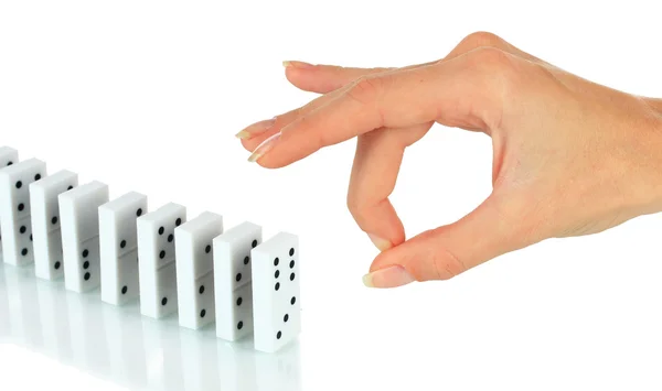 Mão empurrando dominó isolado no branco — Fotografia de Stock