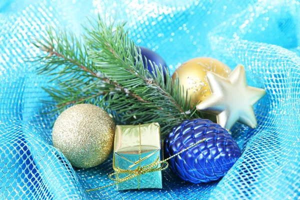 Beautiful Christmas decor on blue cloth — Stock Photo, Image