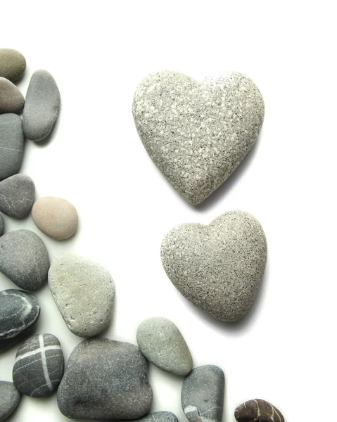 Szare kamienie w kształcie serca, na białym tle — Zdjęcie stockowe
