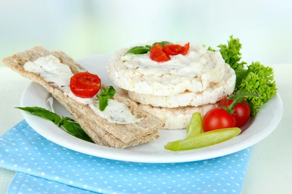 Tasty crispbreads with vegetables on white table — Stock Photo, Image