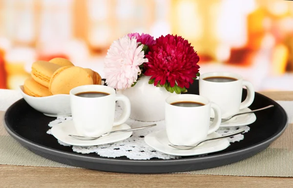 Cups of coffee on tray on table in cafe — Stock Photo, Image