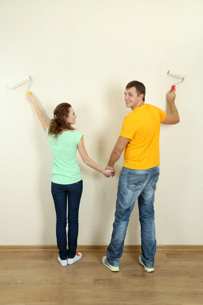 Young couple doing renovation in new house Stock Photo