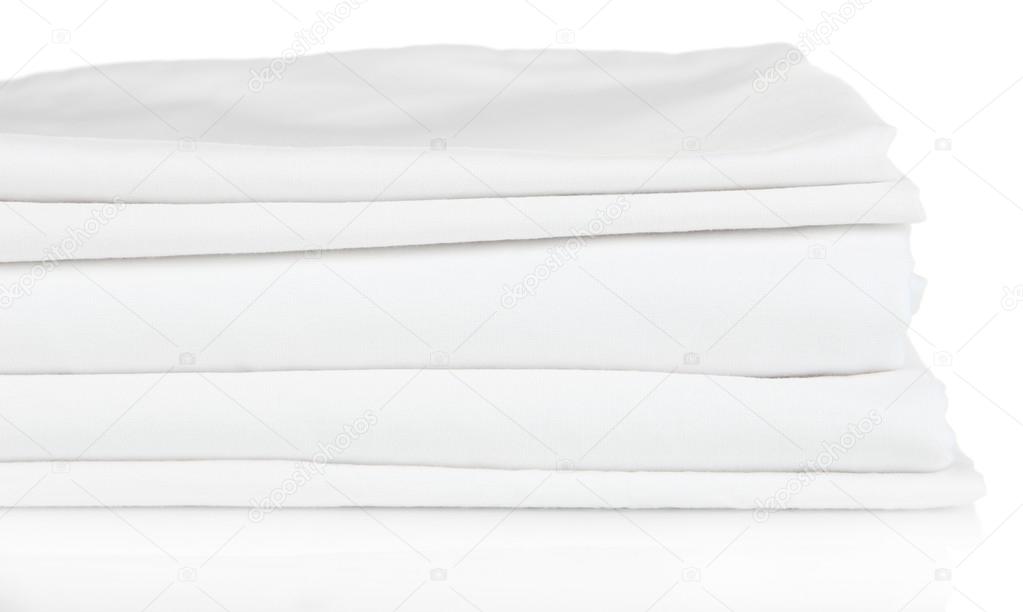 Stack of clean bedding sheets isolated on white