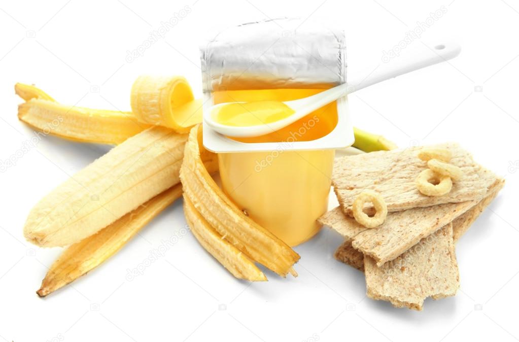 Tasty dessert in open plastic cup and banana, isolated on white