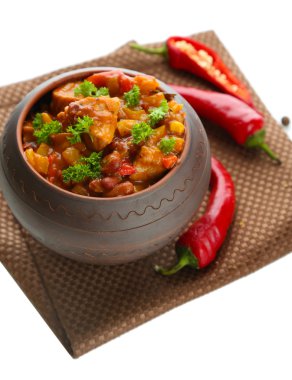 Chili Corn Carne - traditional mexican food, in pot, on napkin, isolated on white clipart