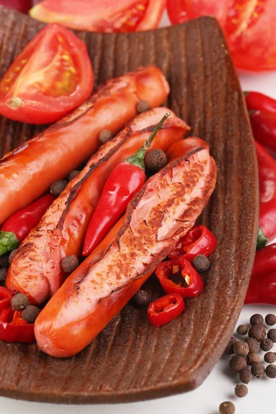 Delicious sausages on plate close-up — Stock Photo, Image